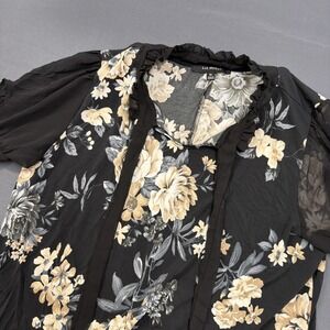 Liz McCoy blouse features a black base with a cream and gold floral print